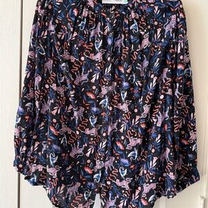 Anthropologie x Super Nice Letters button-down top featuring a vibrant pattern